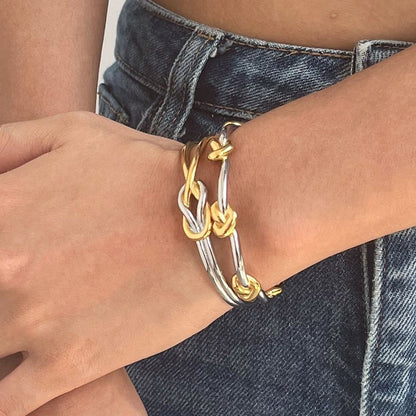 Wrist stack with the two-tone Entwined Knot open bangle