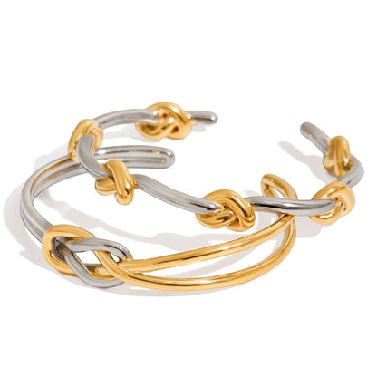 Entwined Knot two-tone open cuff bangle on a white background