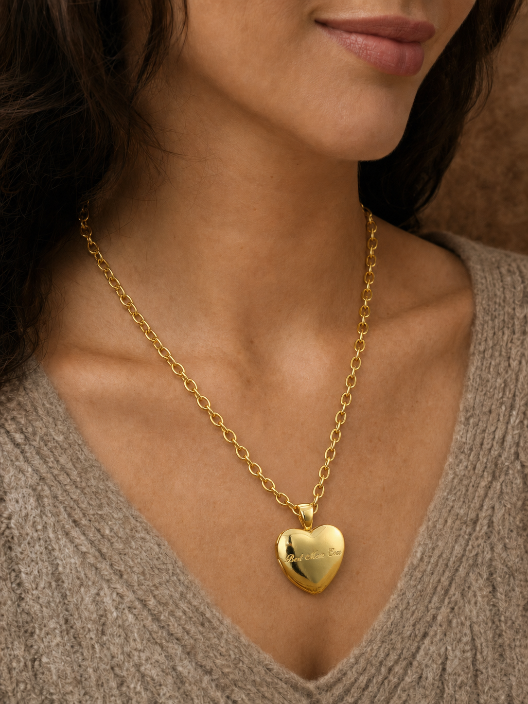 Woman wearing a gold heart locket necklace with custom photo